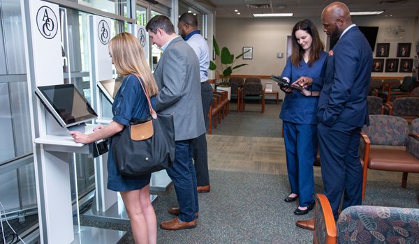 Patients Checking In to Ophthalmology Practice Using Clearwave's Self-Service Check In Kiosk