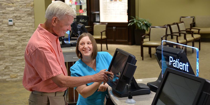 Patient using Clearwave’s self-service check in technology
