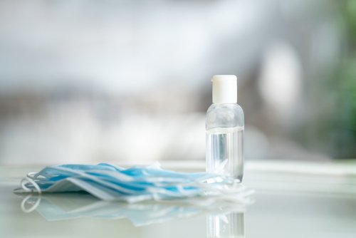 masks and bottle on table 