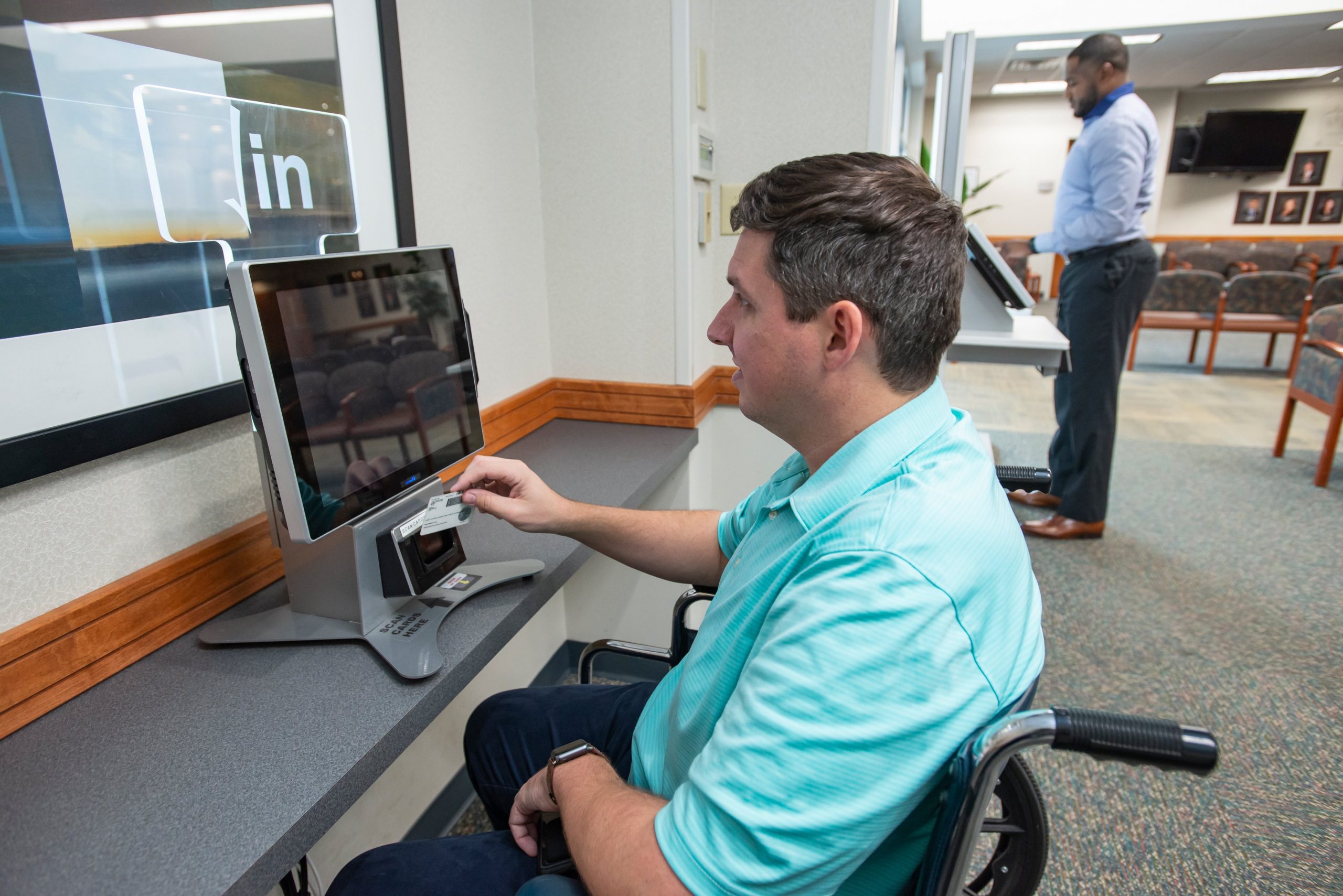 man using computer at healthcare center