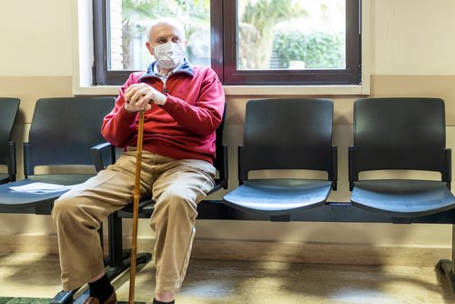 Older man in oncologist waiting room 