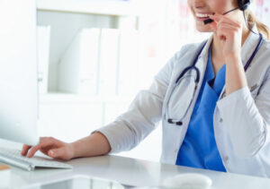 doctor using phone to talk to patient 